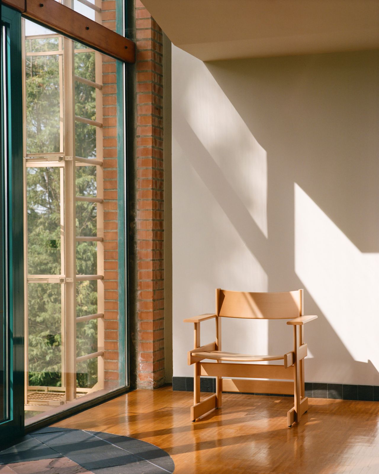 A lifestyle image of a lounge scene featuring Bullnose Lounge Chair.