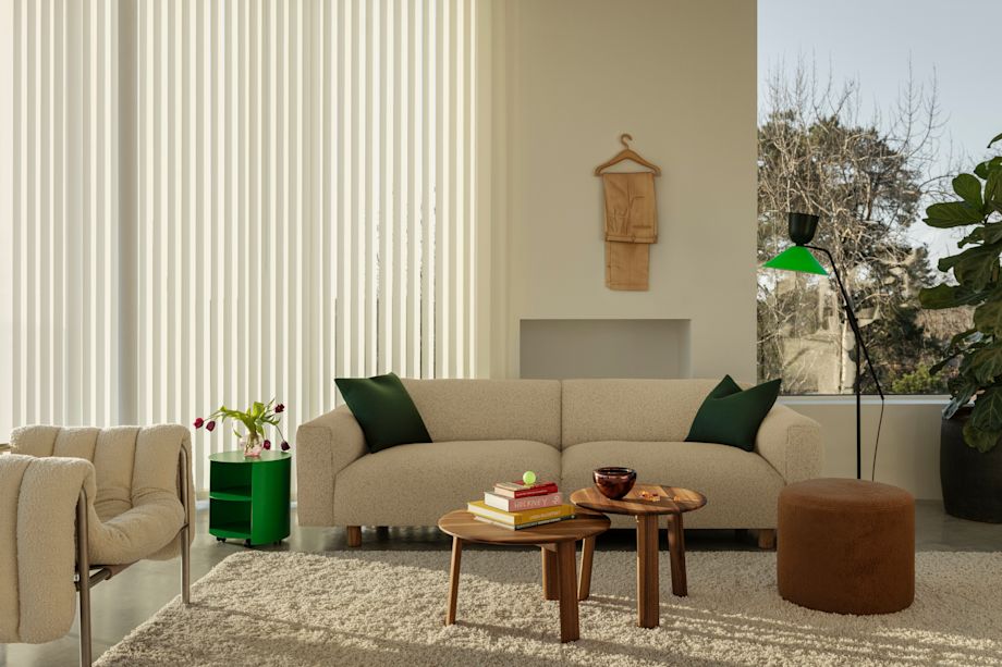 Hem - A living room scene featuring Puffy Lounge Chair in Eggshell / Stainless, Koti 3-seater sofa in Eggshell, Bon Pouf Round in Brown, Alphabeta Floor Lamp and Alle Coffee Tables Set of 2 in Walnut.