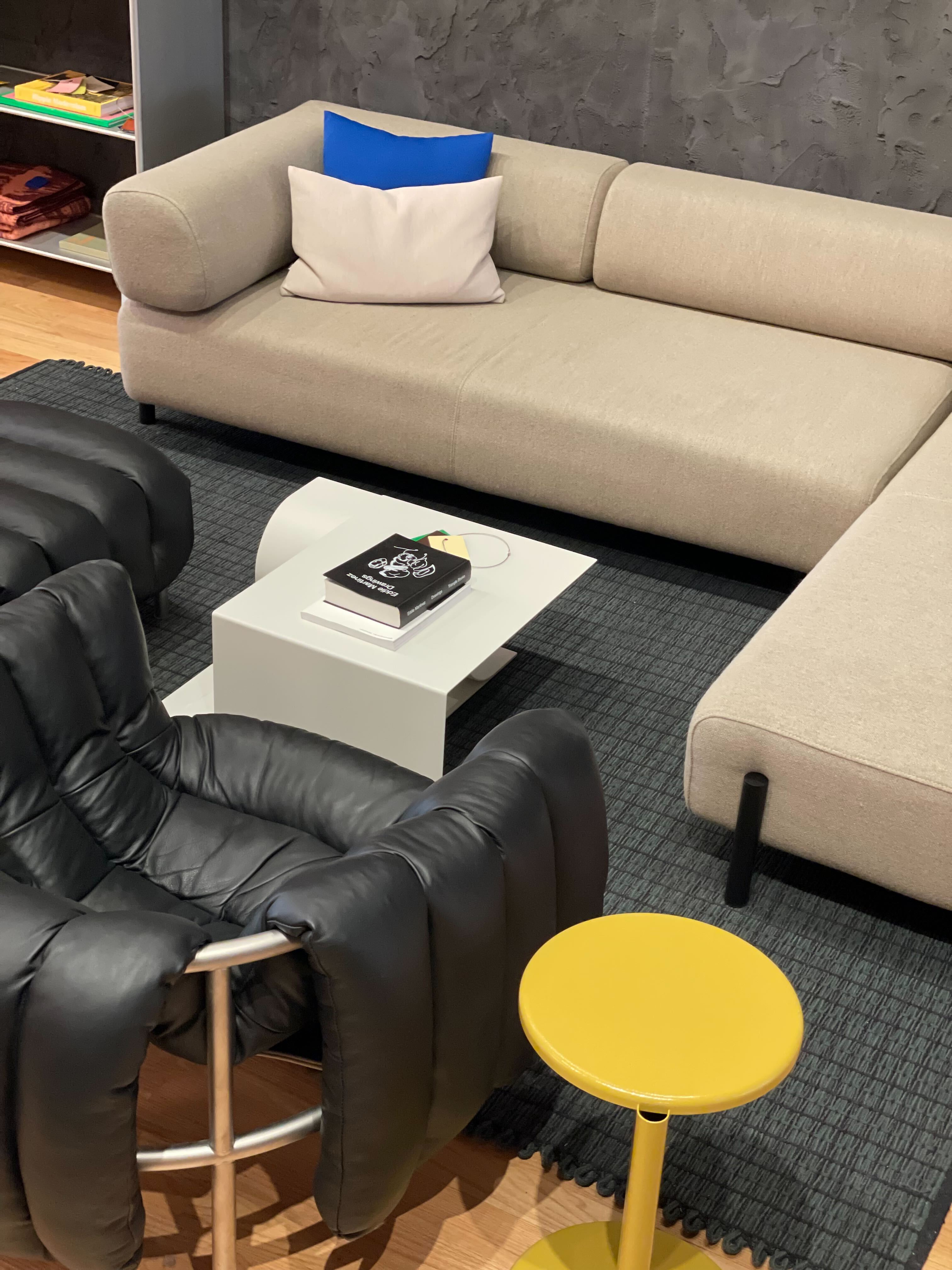 An editorial image from our NYC showroom featuring Palo Modular Sofa, Lolly Side Table, Puffy Lounge Chair, Rope Rug, Glyph Side Table, and Neo and Storm Cushions.