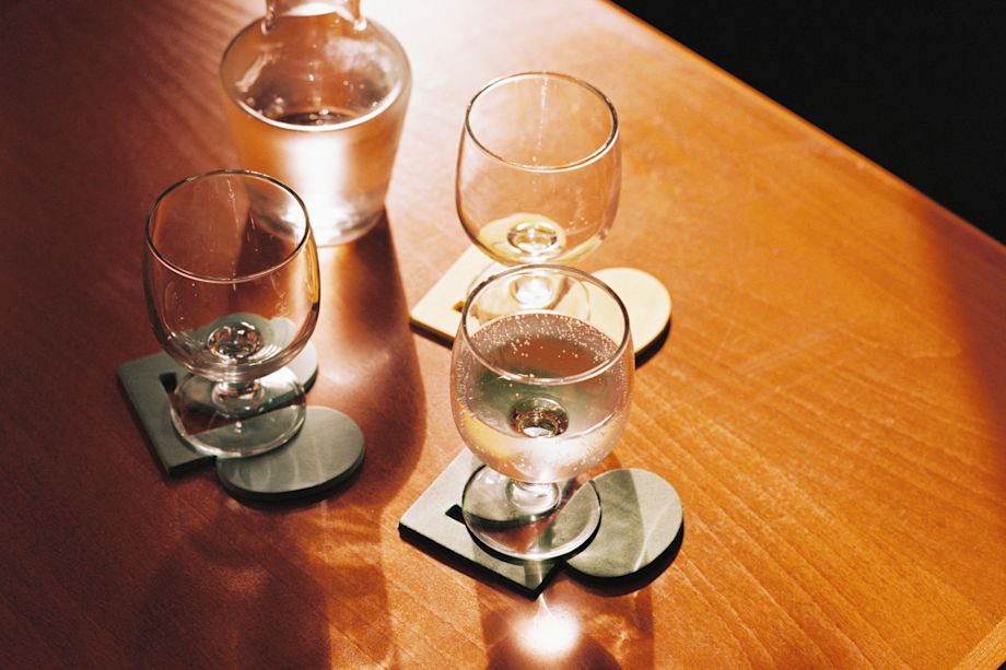 A lifestyle image of a dining/kitchen scene featuring Disco Coasters.