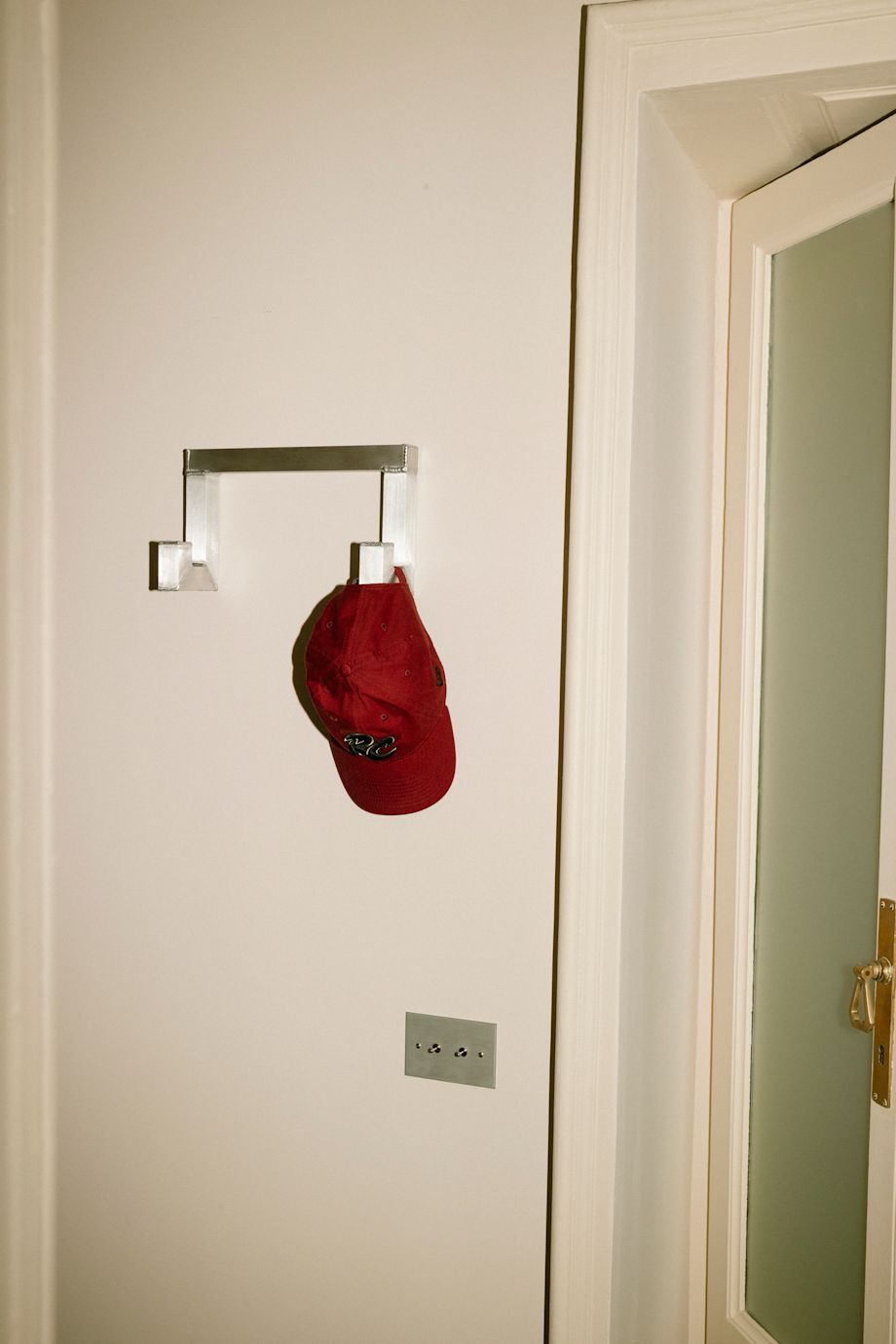 A lifestyle image of a hallway scene featuring Tig Hook Double by designer Kwangho Lee.