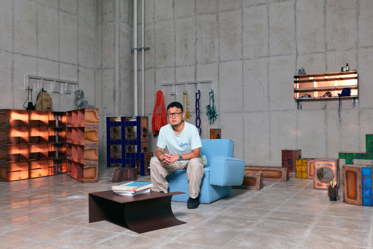 An editorial image of Kwangho Lee, the designer of Hunk Lounge Chairs and Glyph Side Tables taken by Jihoon Kang.
