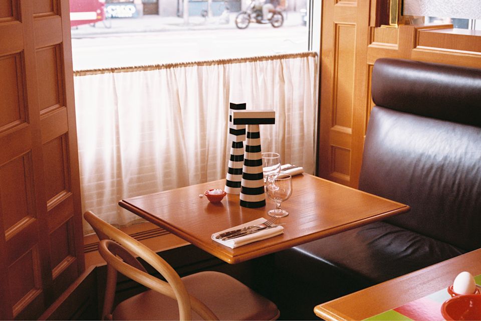 A lifestyle image of a dining/kitchen scene featuring Molino Grinders and Bronto Egg Cup.