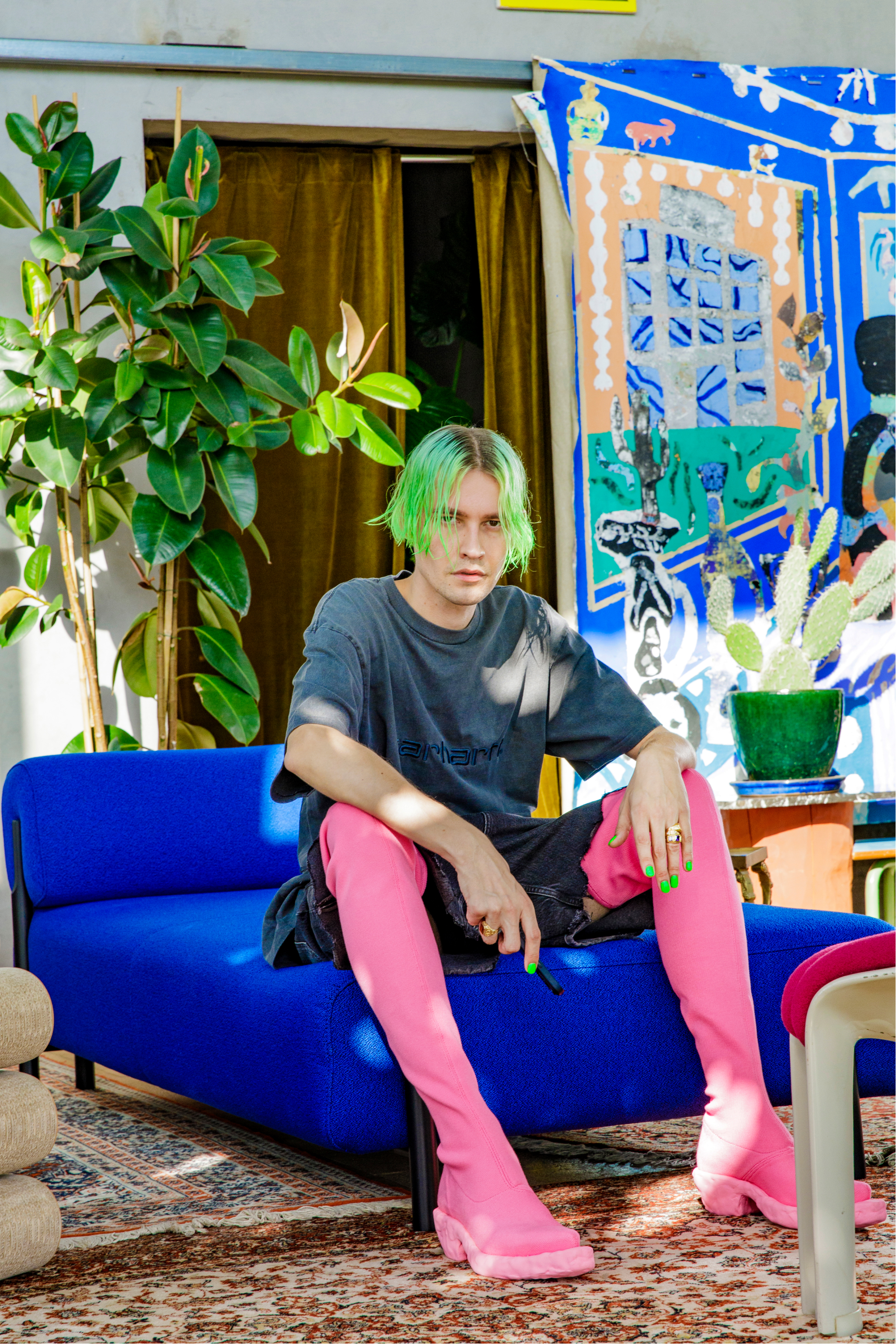 Achilles sitting on our [Palo Modular Lounger Cobalt](/furniture/sofas-and-poufs/palo/20364)