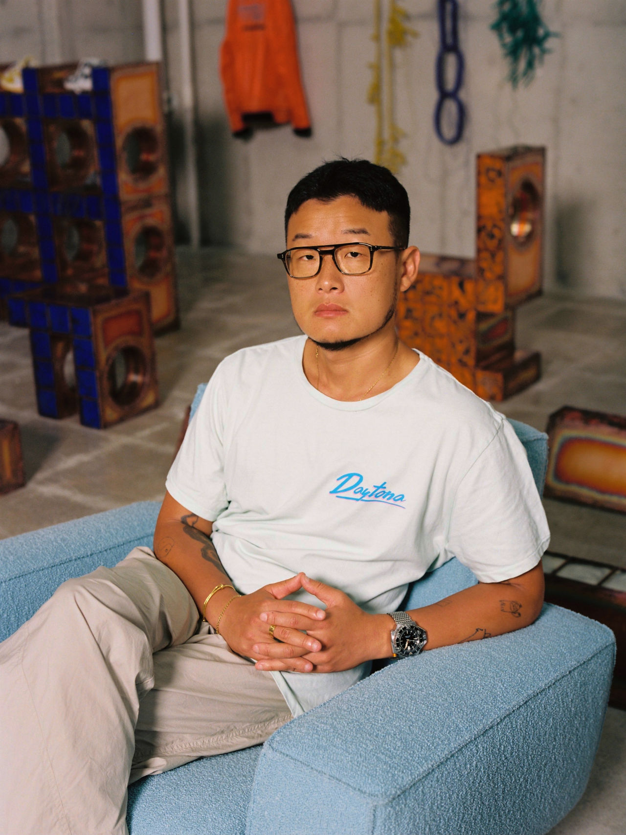 An editorial image of Kwangho Lee, the designer behind the Hunk Lounge Chairs and Glyph Side Tables taken by Jihoon Kang.