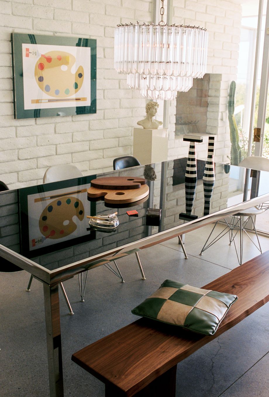 A lifestyle image of a dining room scene featuring Molino Grinders, Palette Cutting Boards, and Bookmatch Bench.