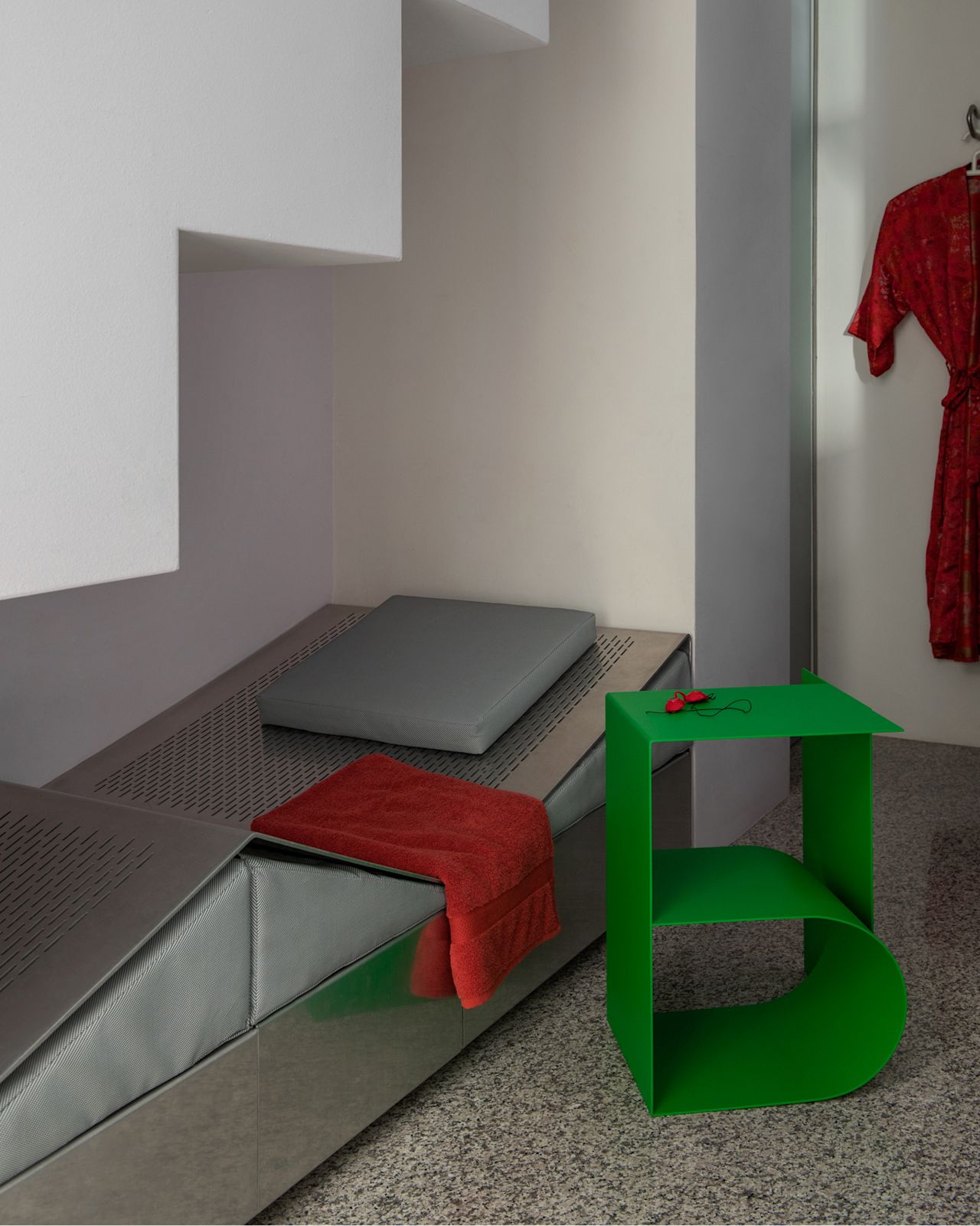 A lifestyle image of a lounge scene featuring Glyph Side Table Beta Pure Green.