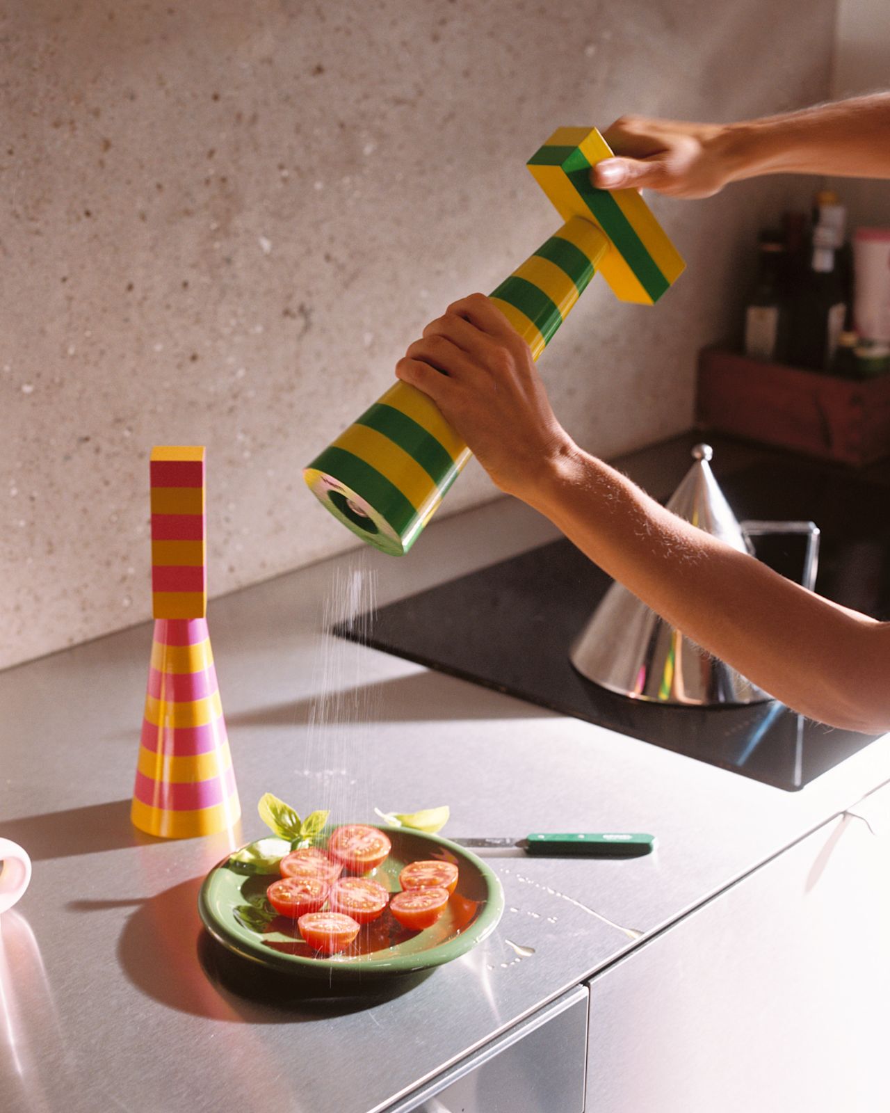 A lifestyle image of a kitchen scene featuring Molino Grinders and Bronto Tableware.