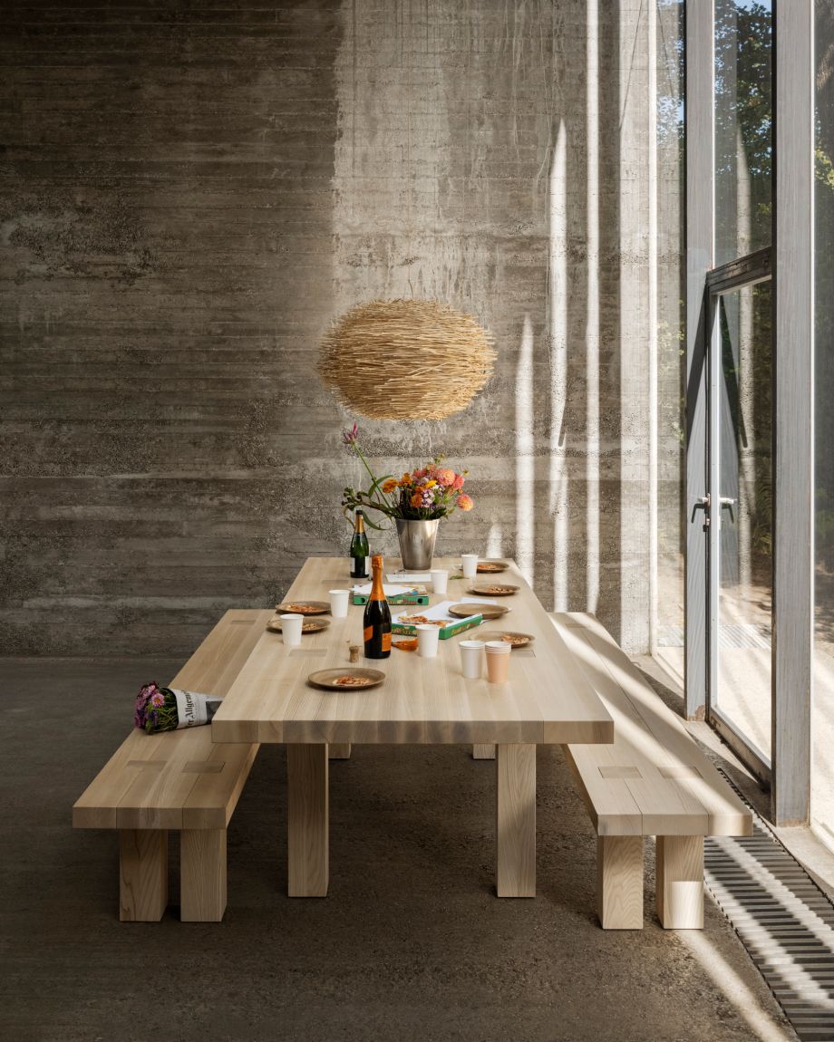 A lifestyle image of a dining scene featuring Max Table + Benches Set.