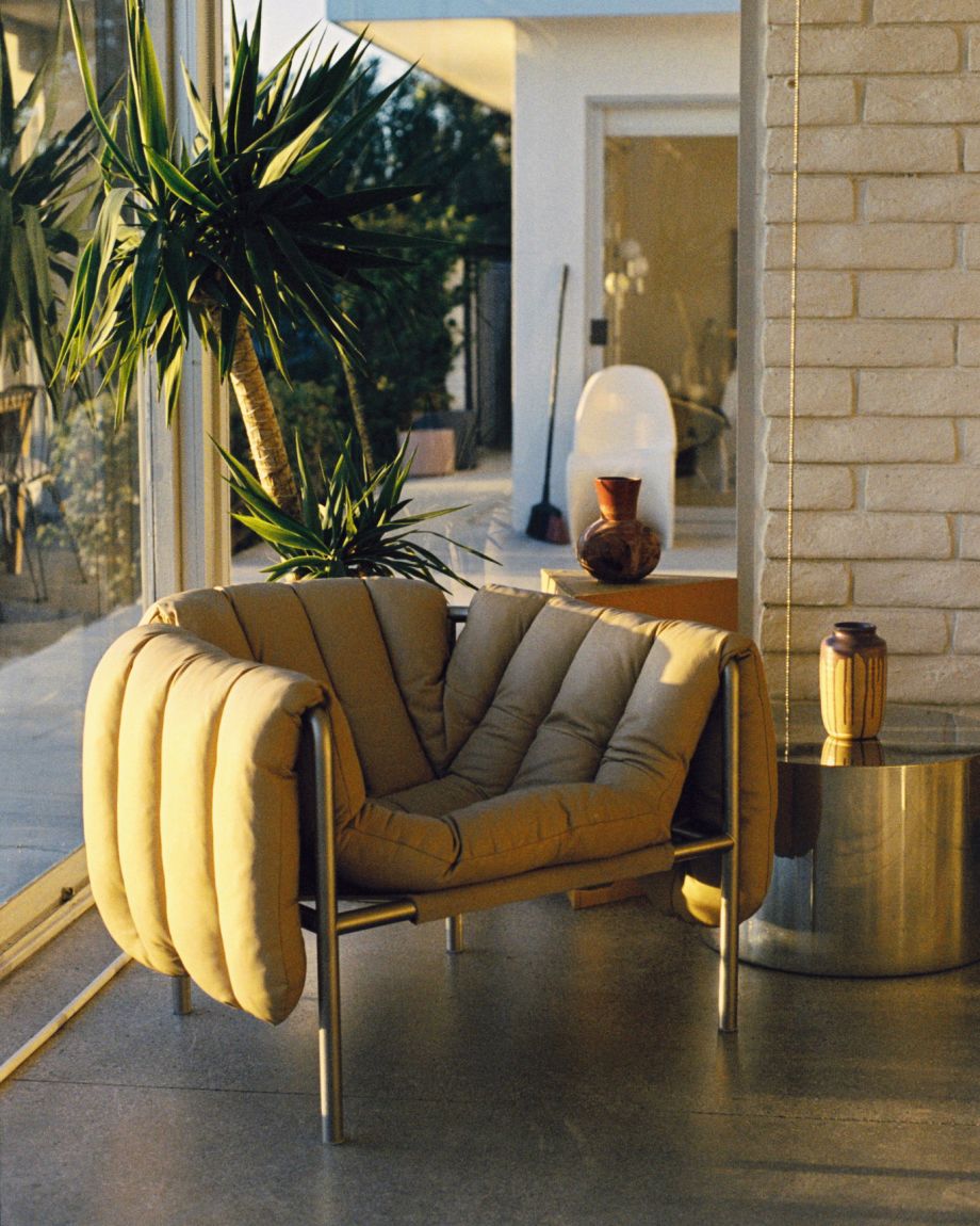 A lifestyle image of a lounge scene featuring Puffy Lounge Chair.
