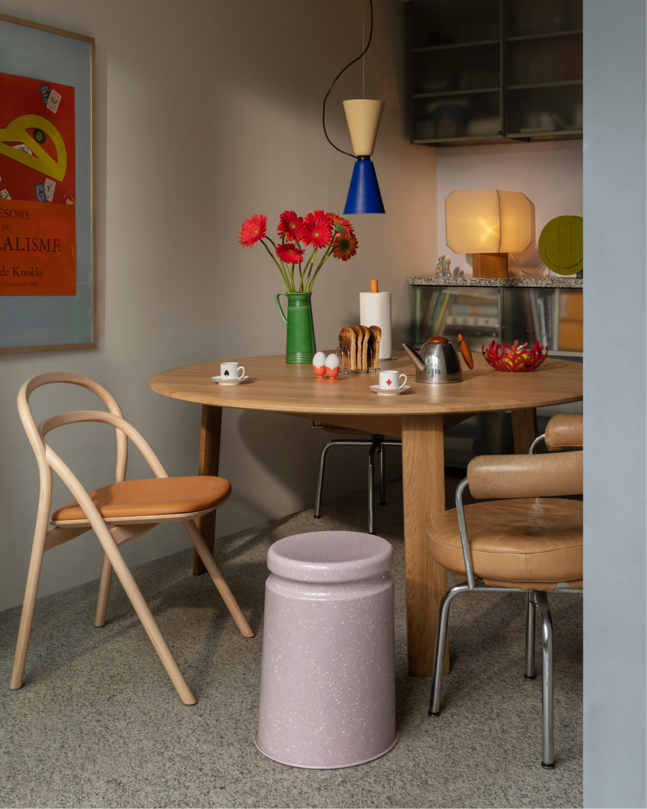 Hem - A lifestyle image of a small kitchen featuring Alphabeta Pendant Light, Udon Upholstered Chair, Last Stool, and Alle Round Dining Table.