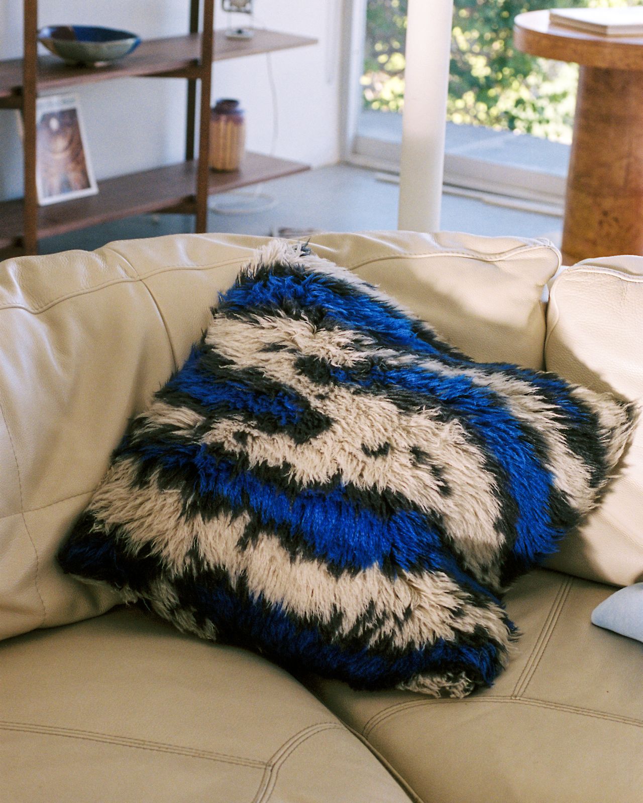 A lifestyle image featuring Monster Cushion Medium Ultramarine Blue/Off-white.