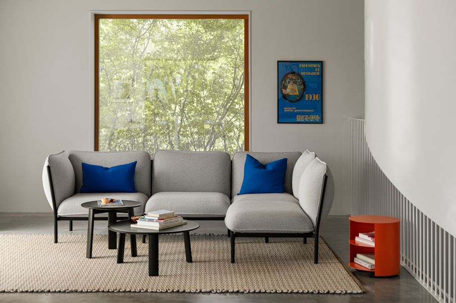 A lifestyle image of a living room/lounge scene featuring Rope Rug, Kumo Sofa, Alle Coffee Tables, Hide Side Table, and Storm Cushions.