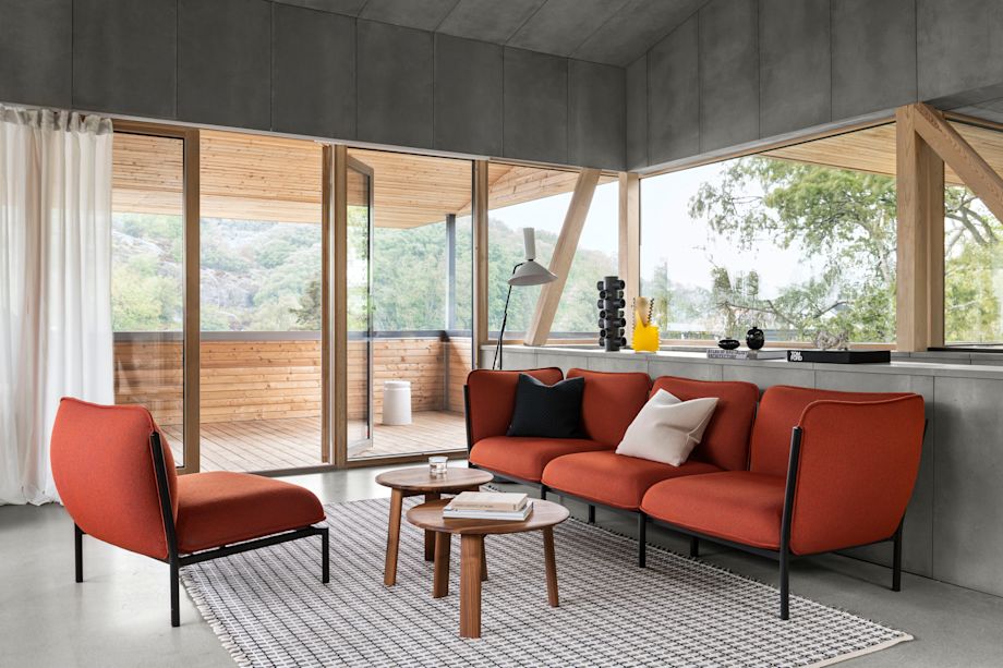 A lifestyle image of a living room scene featuring Kumo Sofa in Canyon, Rope Rug, Alphabeta Floor Lamp, Alle Coffee Tables, Last Stool, Neo Cushion and Dash Cushion.