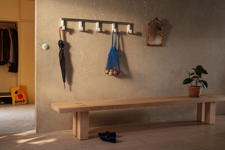 A lifestyle image of a hall scene featuring Max Bench and Tig Hook.