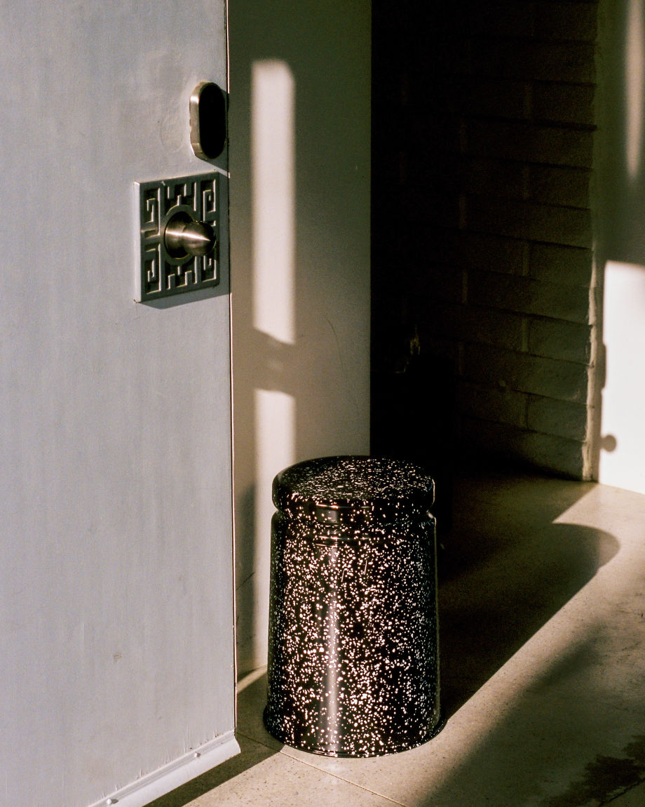 A lifestyle image of a hallway/entryway scene featuring Last Stool Black / White Splatter.