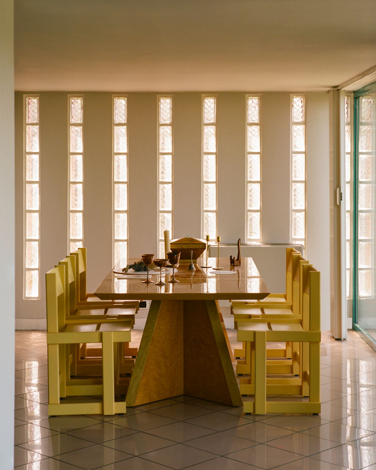 A lifestyle image of a dining scene featuring Bullnose Chairs.