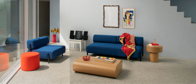 A lifestyle image of a living room/lounge scene featuring Palo Modular Sofa, Bon Pouf Round, Wiggle Vox Frame, Stump Coffee Table Large, Arch Throw, and Stump Side Table.