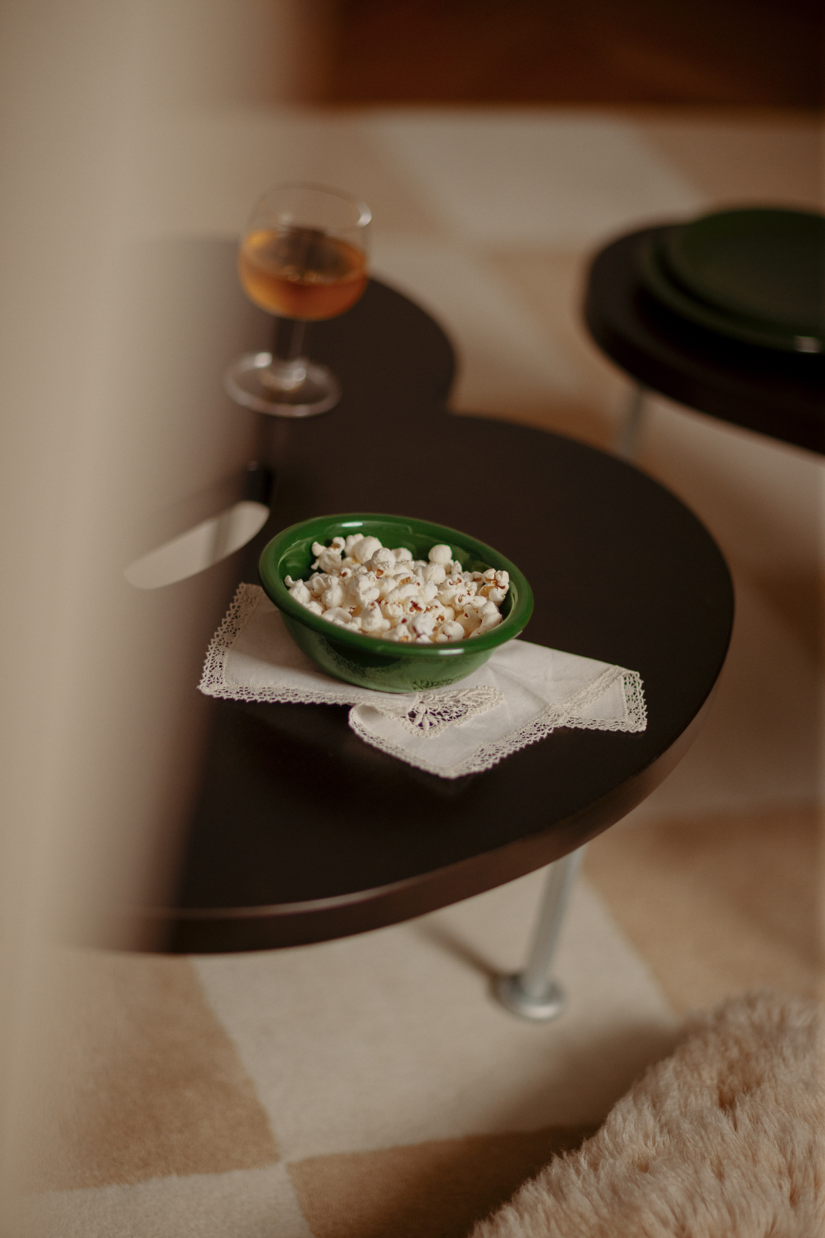 A lifestyle image of a living room/lounge scene featuring Bronto Bowl, Worm Table, Pattern Rug, and Fars Glas.