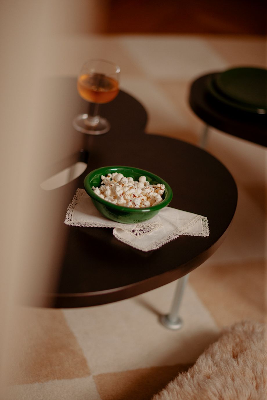 A lifestyle image of a living room/lounge scene featuring Bronto Bowl, Worm Table, Pattern Rug, and Fars Glas.