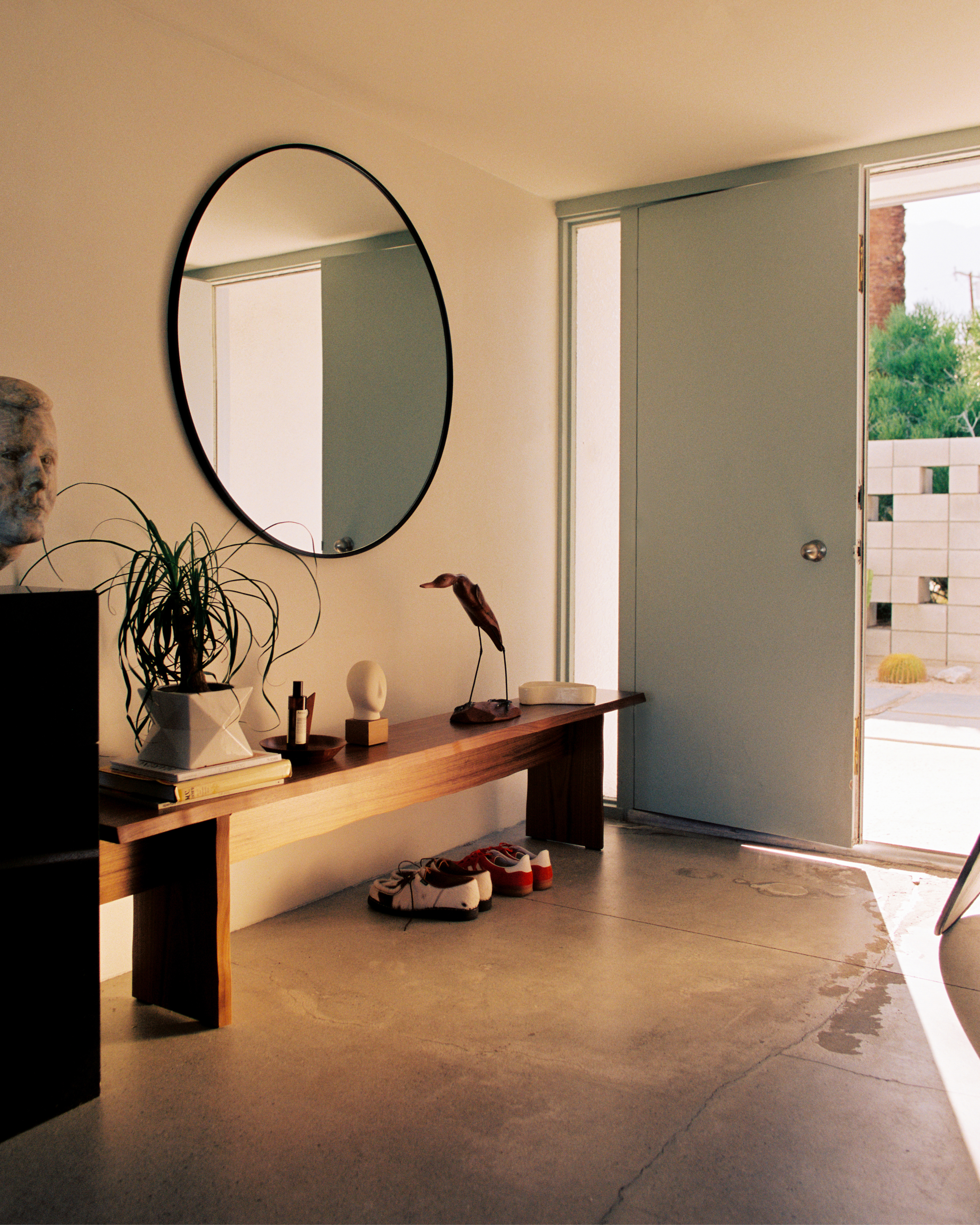 A lifestyle image of a hallway scene featuring Bookmatch Bench in Walnut.