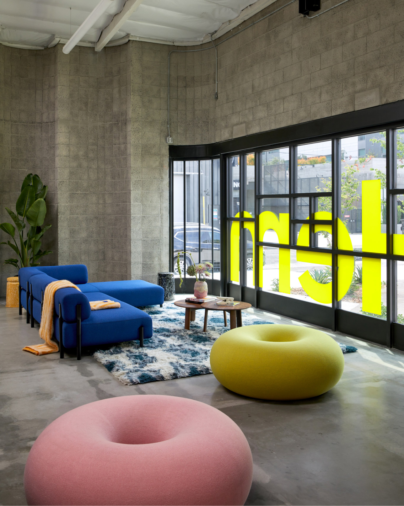 Image of the LA Showroom featuring Boa Pouf, Monster Rug, Monster Throw, Palo Sofa, Alle Coffee Tables, Last Stool, and more.