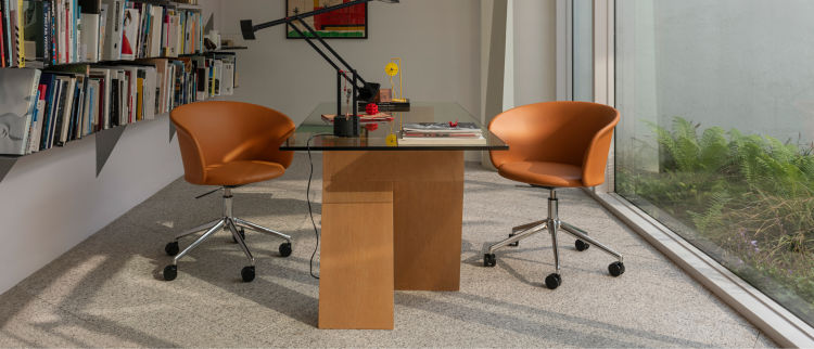A lifestyle image of an office scene featuring Kendo Swivel Chair 5-star Castors, Cognac Leather / Polished.
