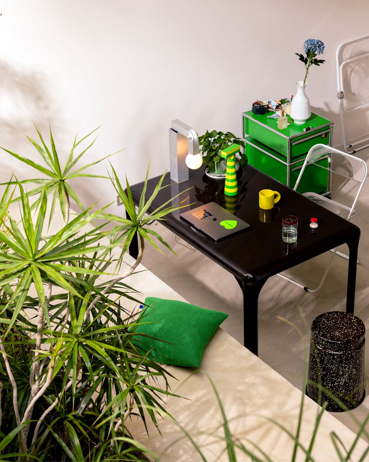 A lifestyle image of an office scene featuring Last Stool, Molino Grinder, Crepe Cushion, Bronto Mug, and Knuckle Table Lamp.