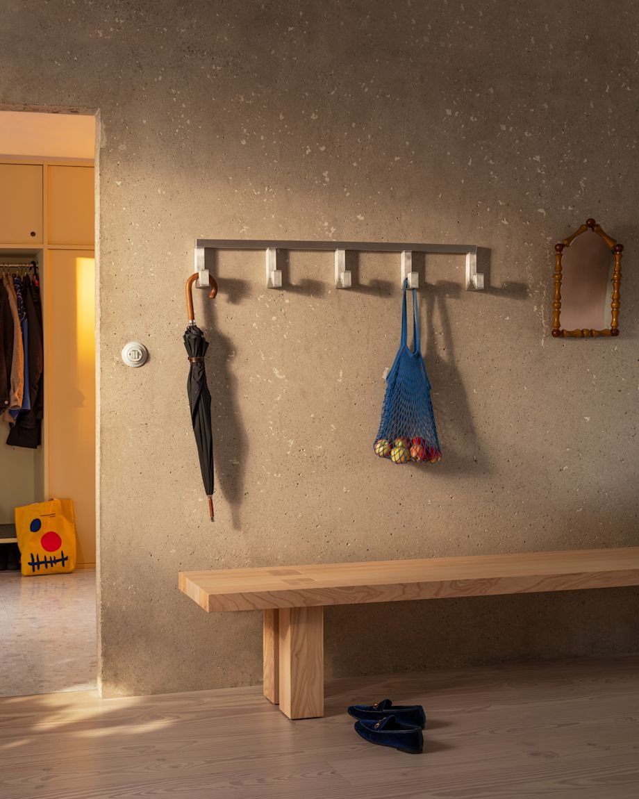 A lifestyle image of a hall scene featuring Max Bench and Tig Hook.