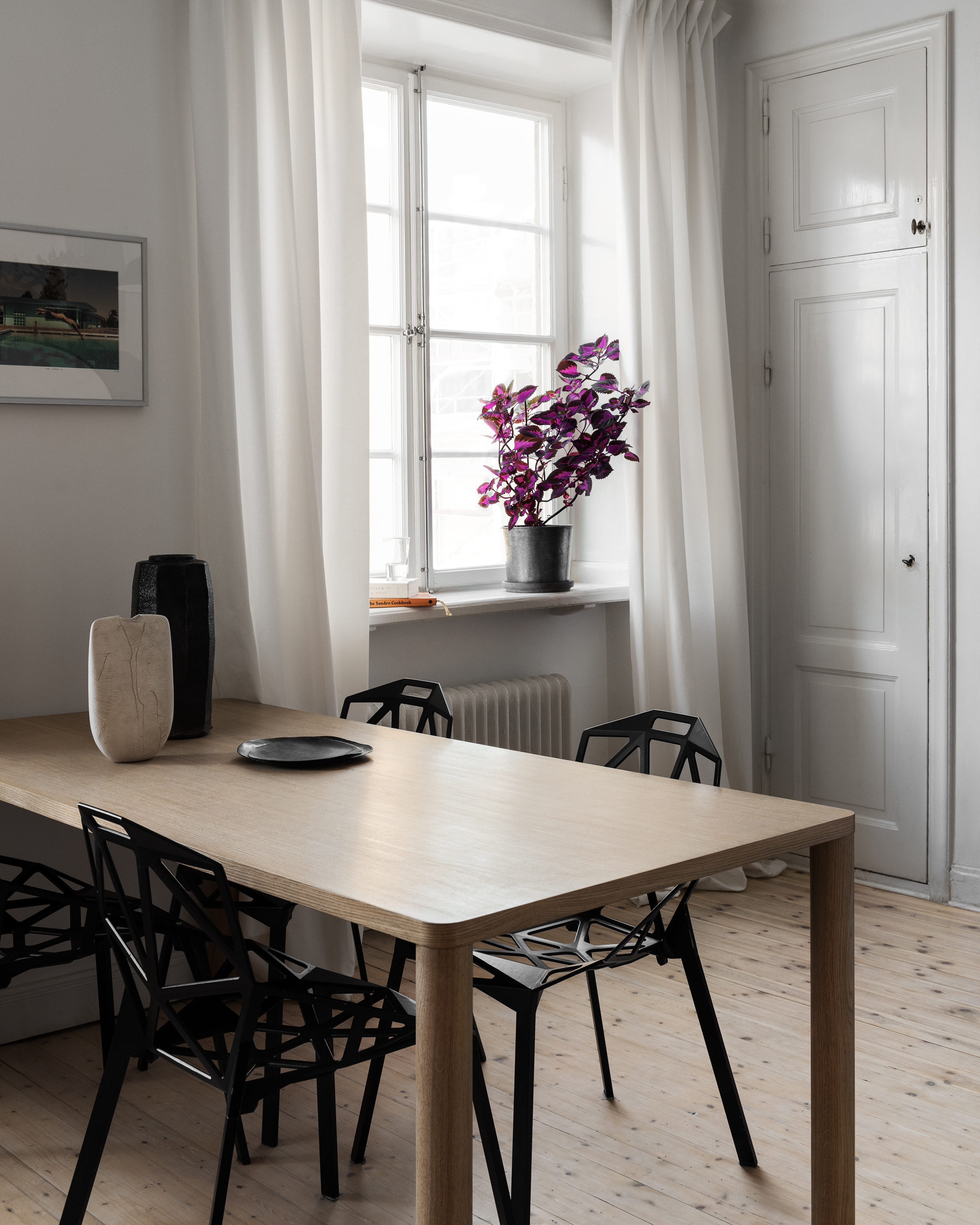 An editorial image of a kitchen/dining scene featuring Log Table.