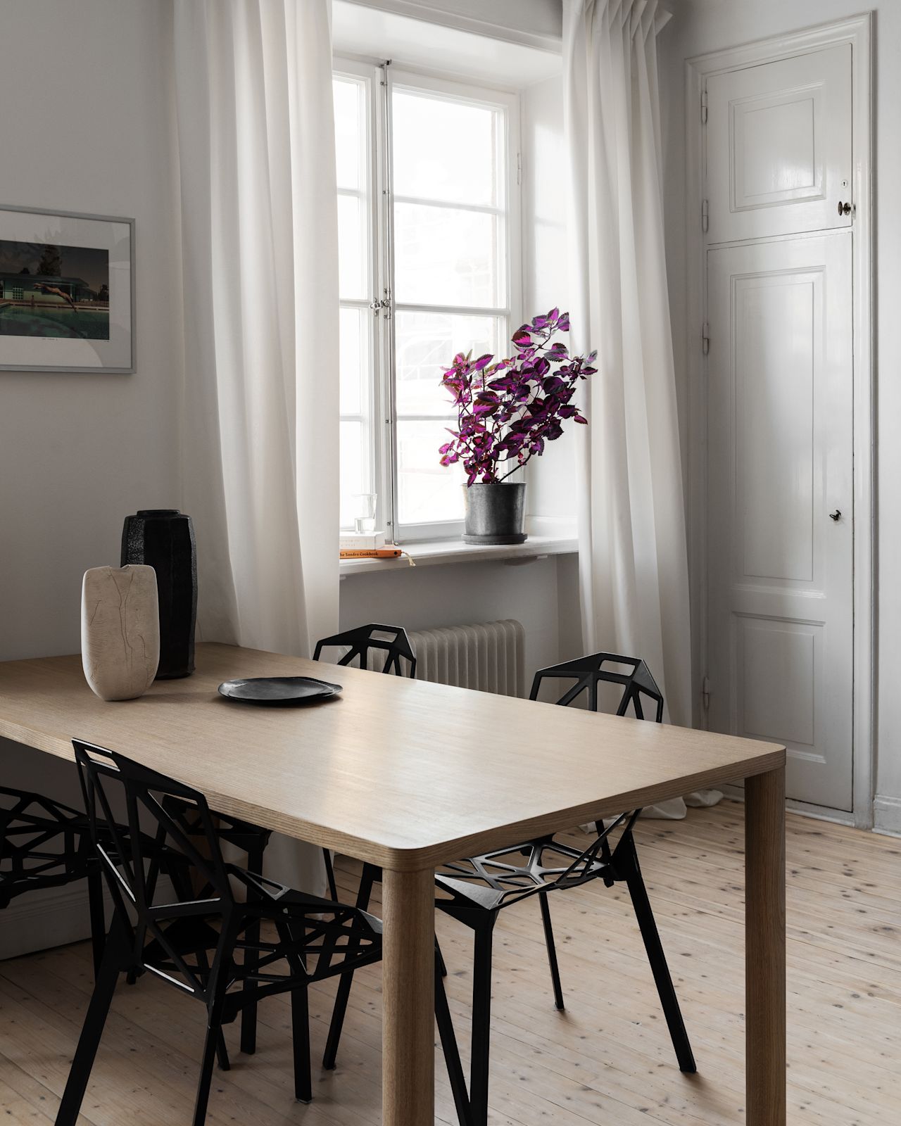 An editorial image of a kitchen/dining scene featuring Log Table.