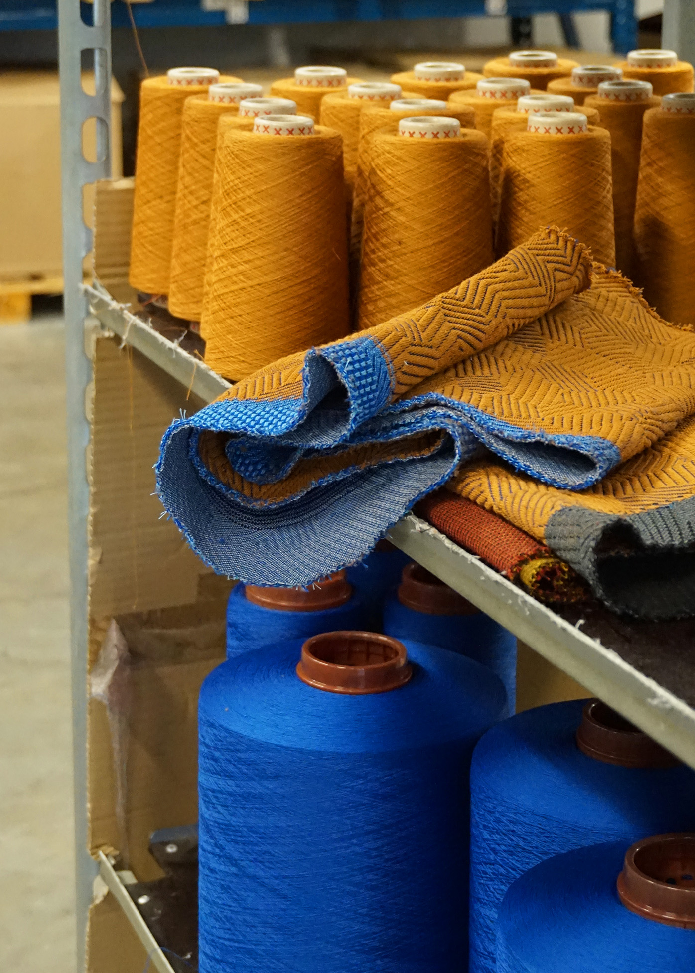 An editorial image from behind the scenes of the factory that makes the fabric for Hem's Hai Lounge Chairs and Bon Poufs.