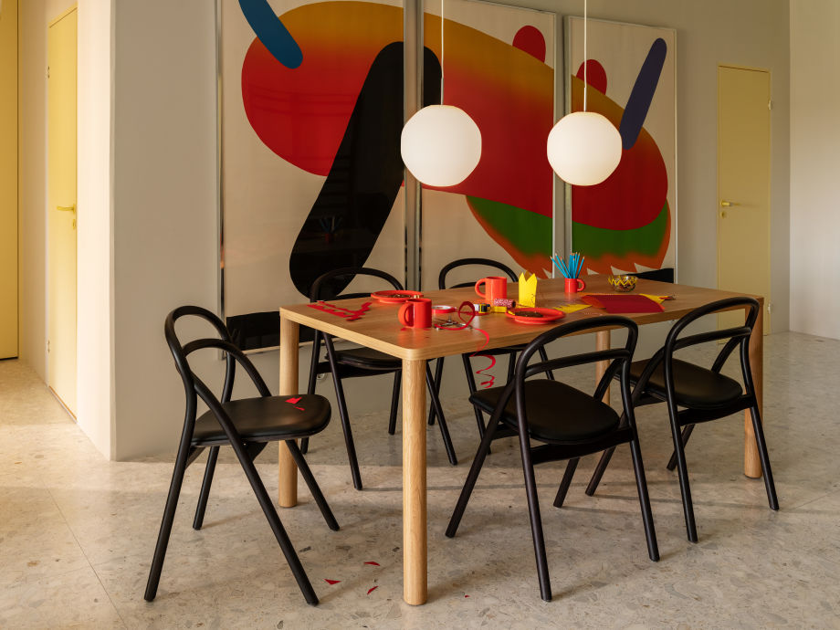 A lifestyle image of a dining scene featuring Coco Pendant Light, Log Table, Bronto Tableware, and Udon Chairs.