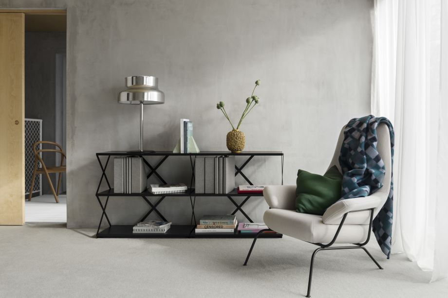 A lifestyle image of a lounge area featuring Lift Shelf, Hai Chair, Vienna Throw and Neo Cushion.