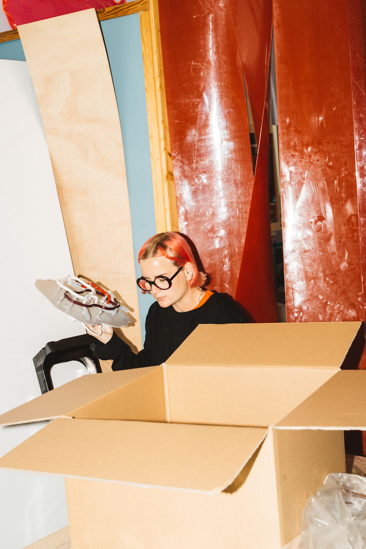 An editorial image from behind the scenes of making Globos Neon, a Hem X limited edition piece.