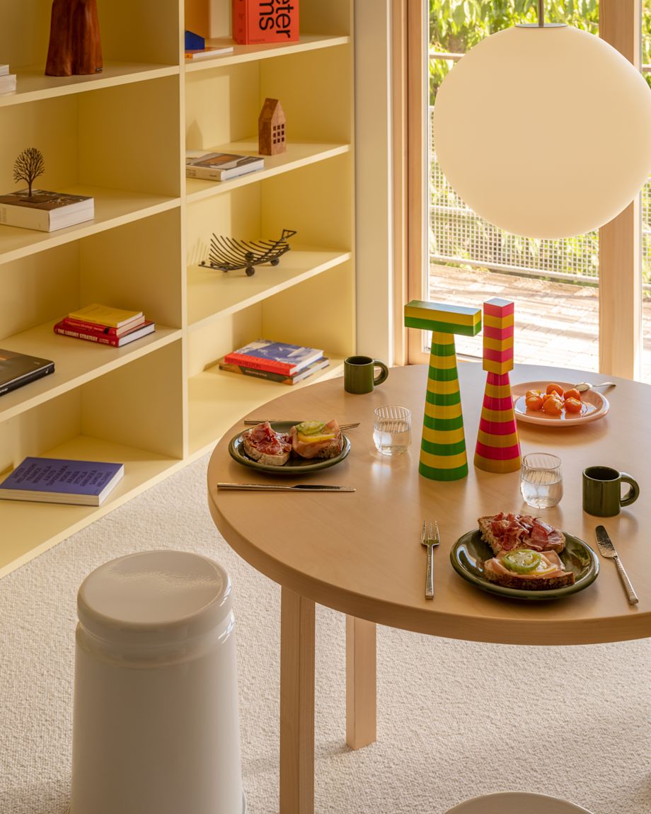 A lifestyle image of a dining scene featuring Coco Pendant Light, Last Stool, Bronto Tableware, and Molino Grinder.