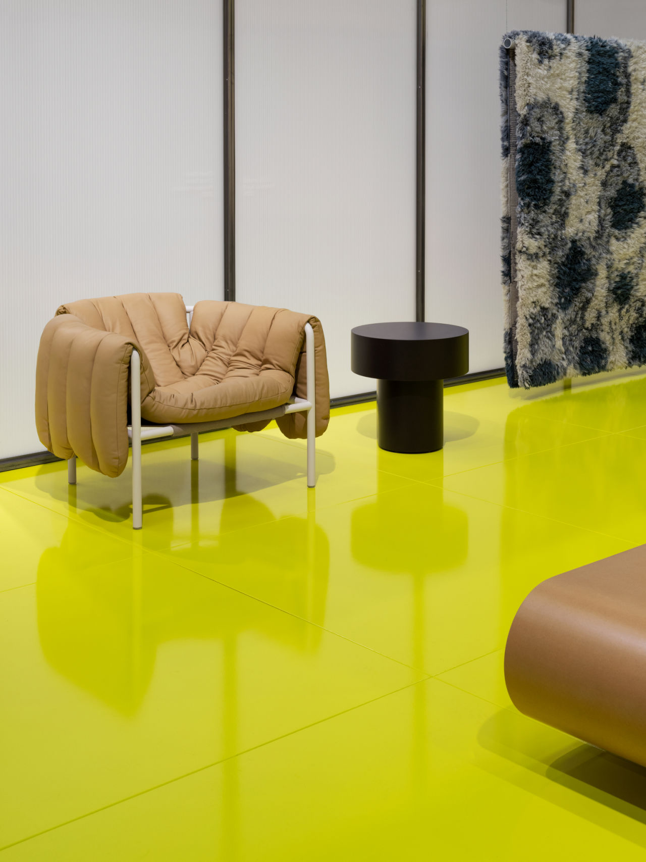 Image from the 2023 Stockholm Furniture Fair featuring Stump Side Table, Puffy Lounge Chair, and Monster Rug.