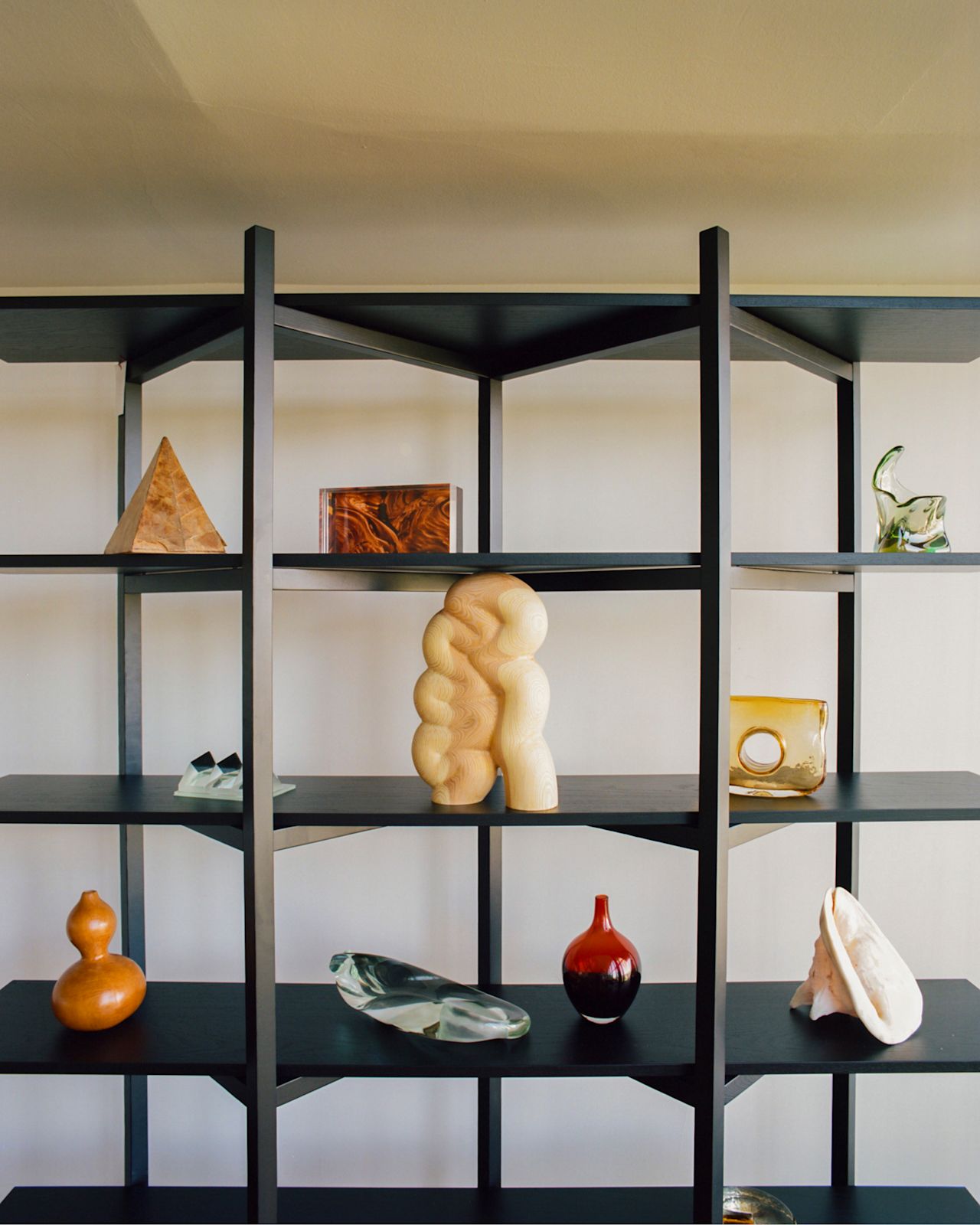 A lifestyle image of an office scene featuring Zig Zag High Shelf in Black, and Fura - a Hem X limited edition piece.