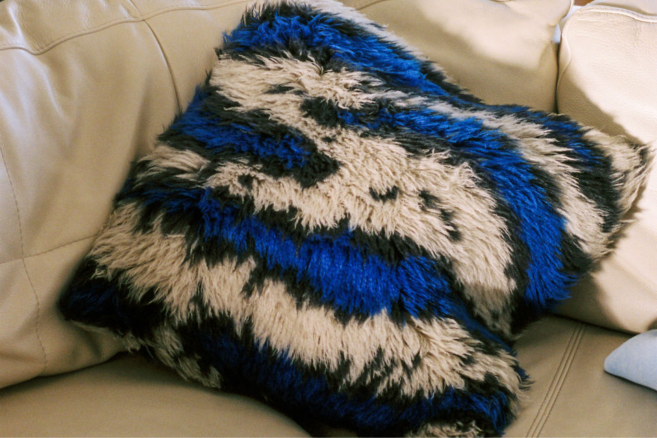 A lifestyle image featuring Monster Cushion Medium Ultramarine Blue / Off-White.
