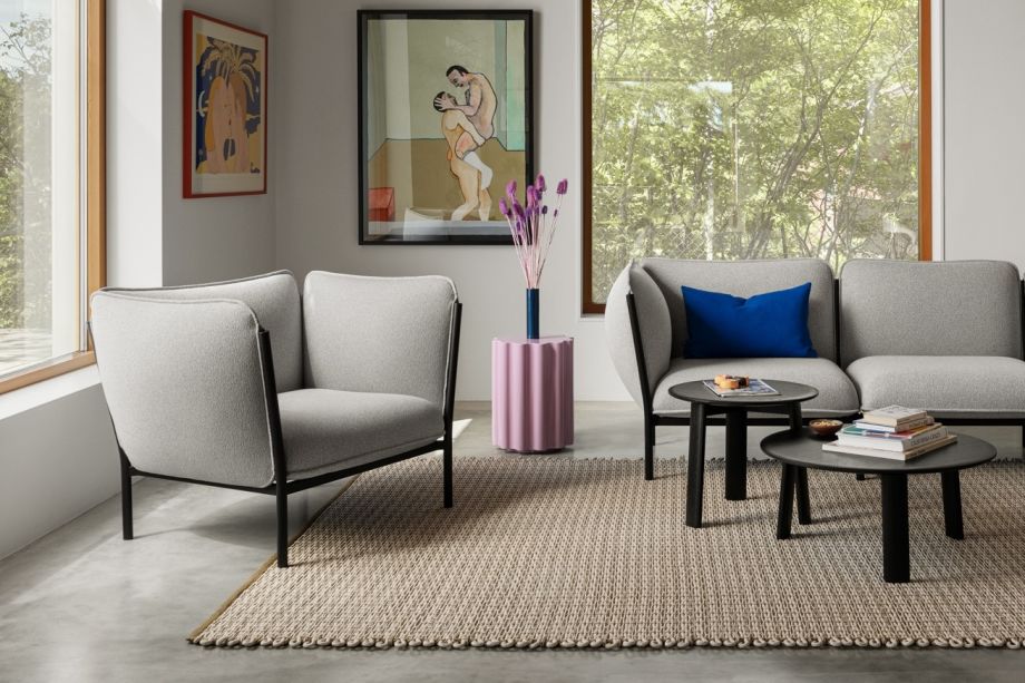 Lifestyle image of a living room scene featuring Kumo Modular Sofa, Alle Coffee Tables, Rope Rug and Storm Cushion.