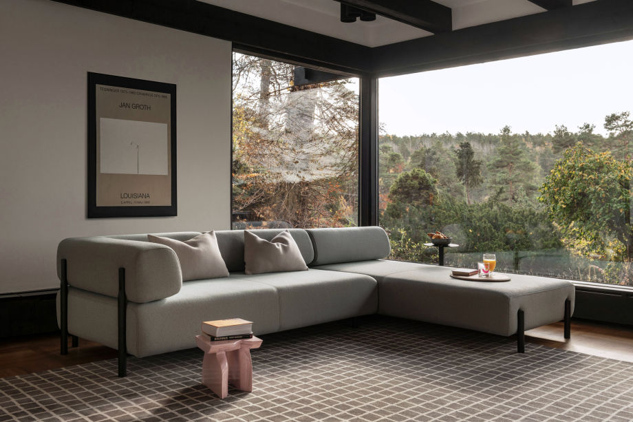 A lifestyle image of a living room scene featuring Palo Modular Corner Sofa Left, Grid Rug and Neo Cushions.