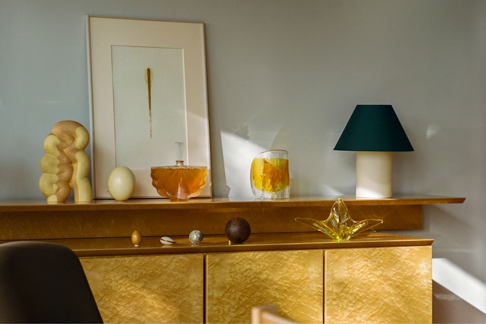 A lifestyle image of a living room scene featuring Toto Table Lamp Medium and Fura - a Hem X limited edition piece.