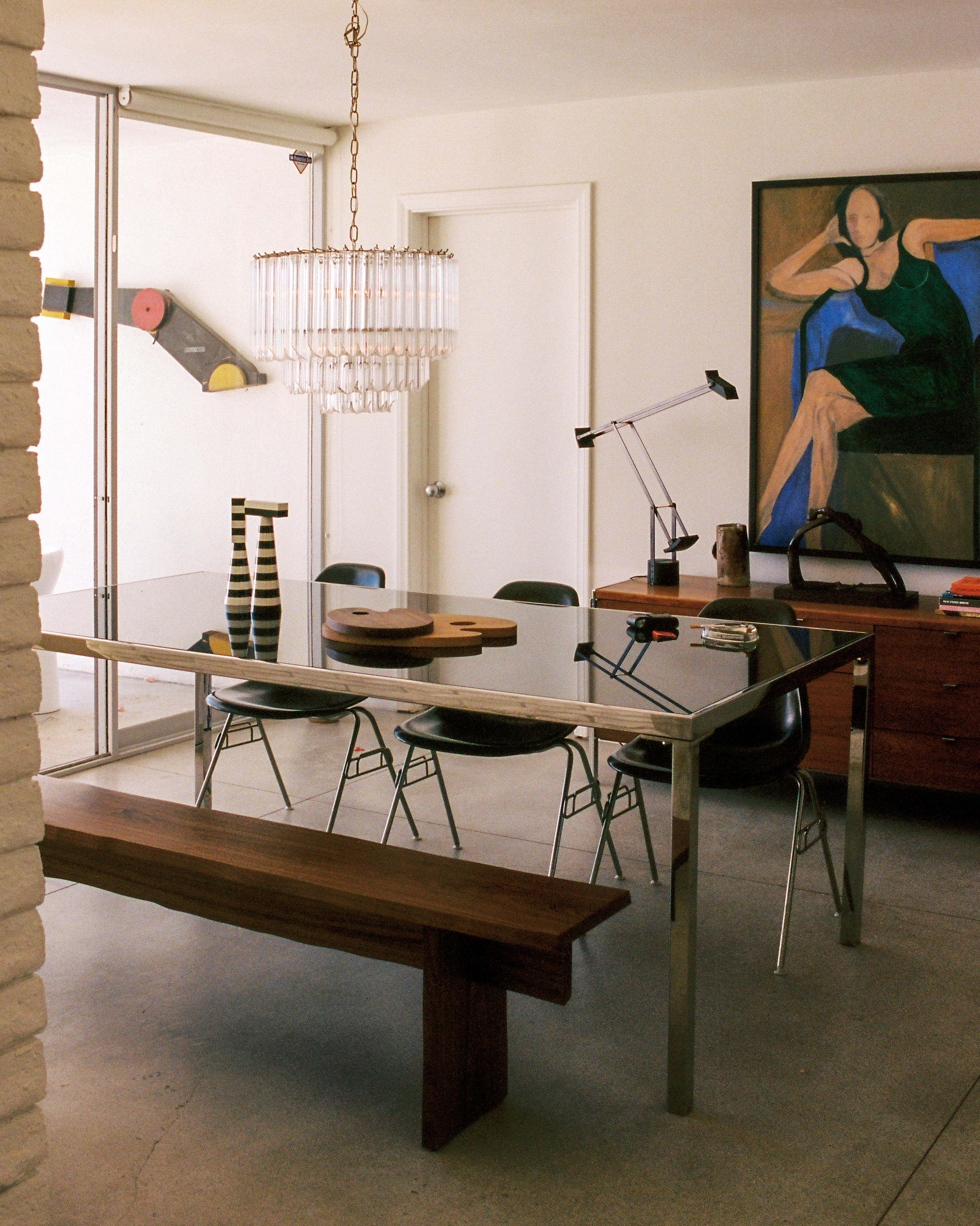 A lifestyle image of a dining scene featuring Bookmatch Bench, Molino Grinders, and Palette Cutting Boards.