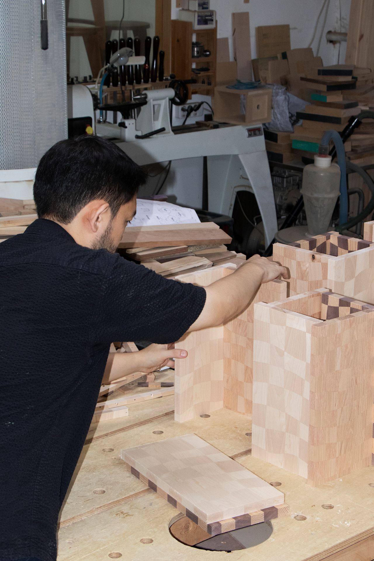 An editorial image from behind the scenes of making Mixwood Vessels, a Hem X limited edition piece by design group Kuo Duo.