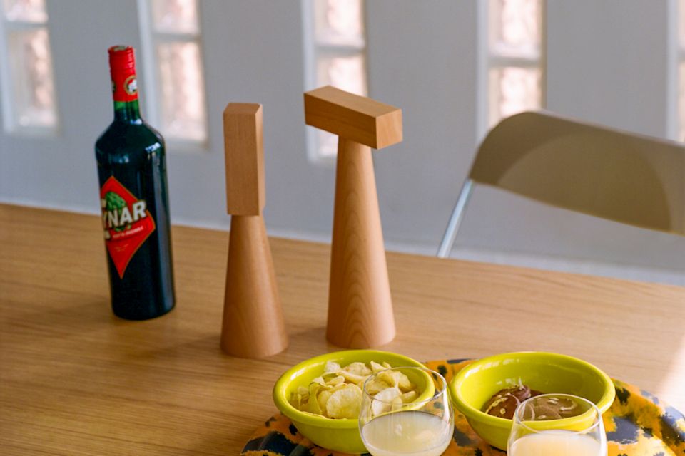 A lifestyle image of a dining scene featuring Molino Grinders, Monster Tray, Bronto Bowls, and Fars Glas.