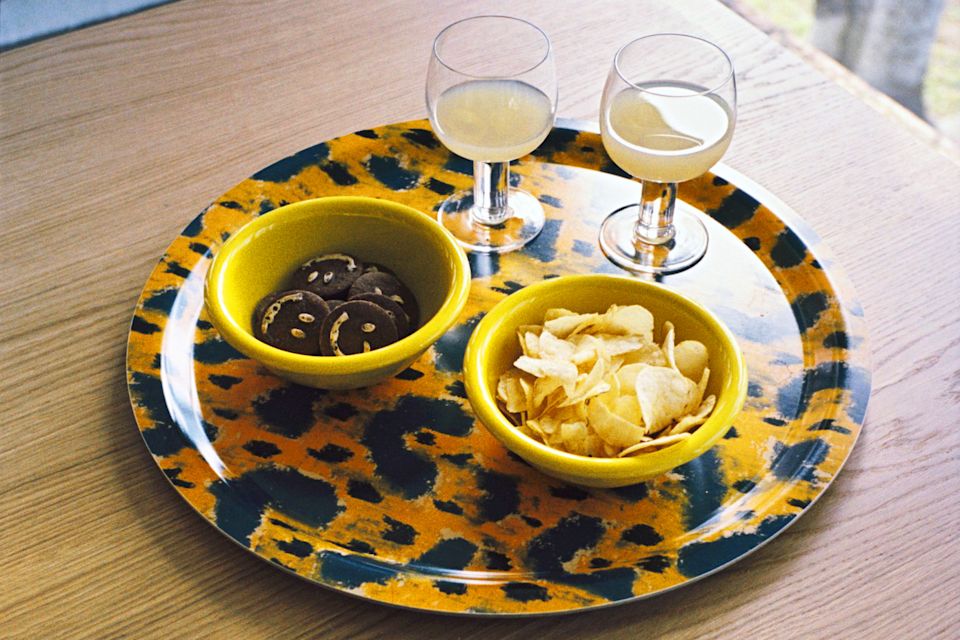 A lifestyle image of a dining scene featuring Monster Tray, Fars Glas, and Bronto Bowls.