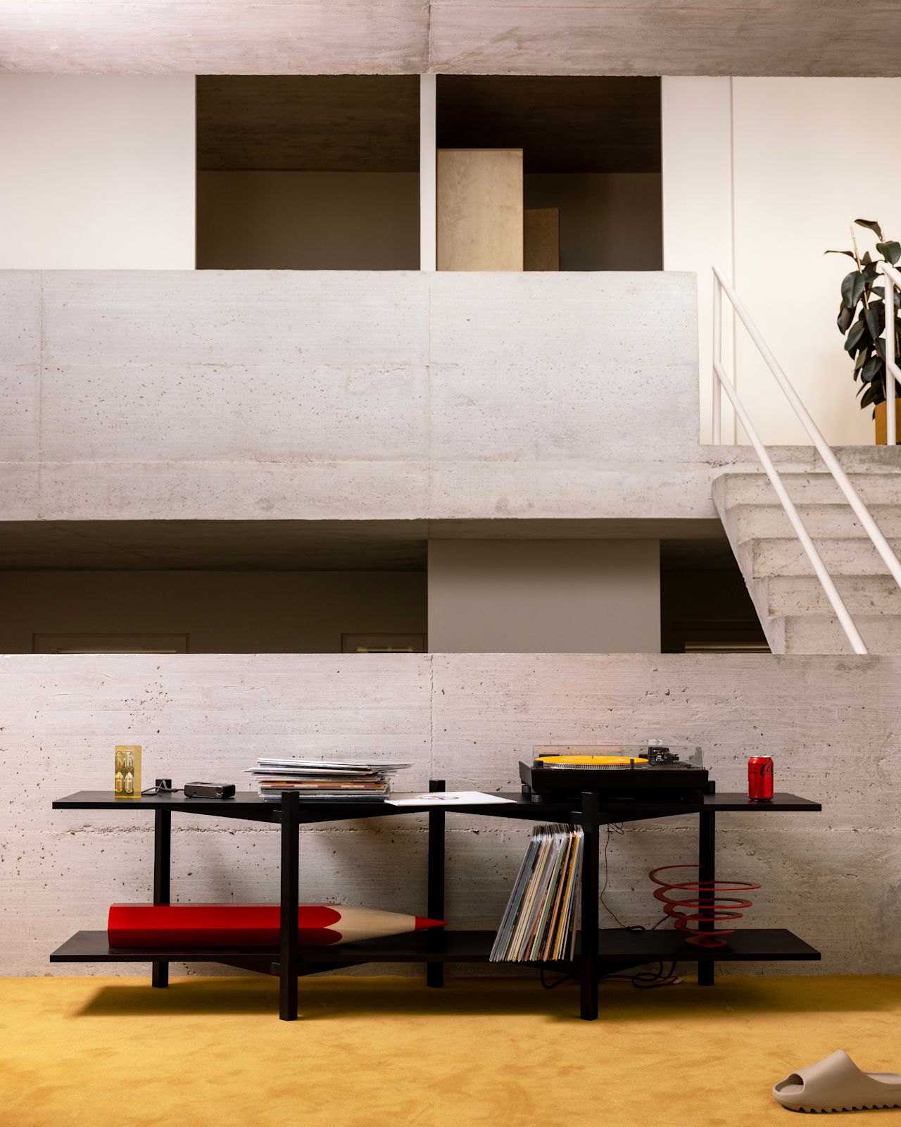 A lifestyle image featuring Zig Zag Media Shelf in Black.