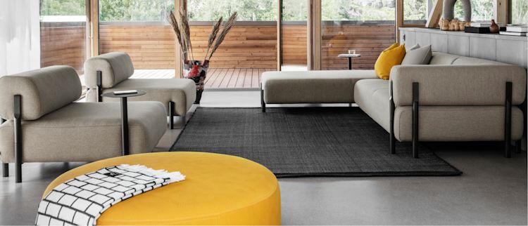 Hem - A living room scene featuring Palo Sofas and Palo Side Table, Dune Rug, Neo Cushions, Brick Throw, and Bon Pouf Round Large.