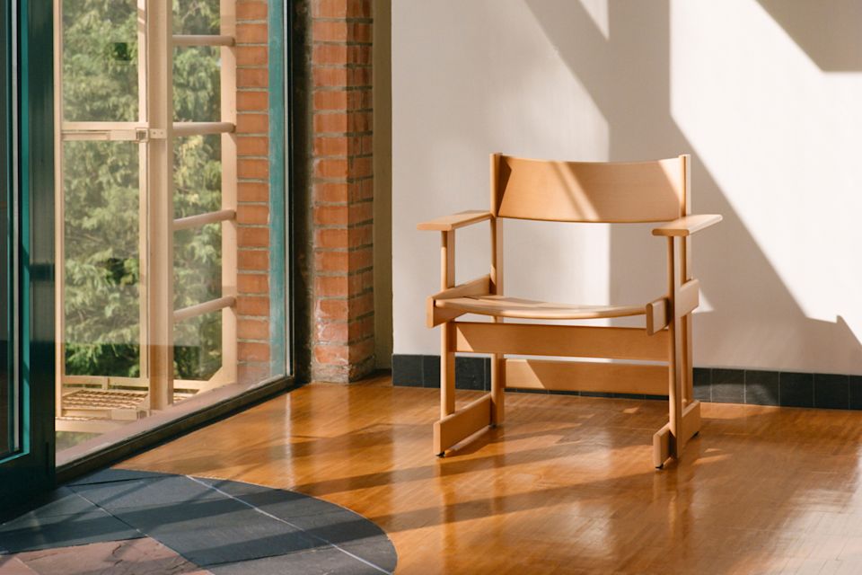 A lifestyle image of a lounge scene featuring Bullnose Lounge Chair.