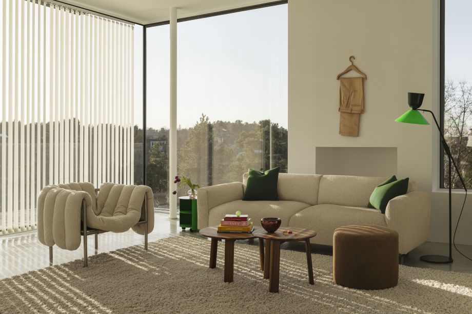 Hem - A living room scene featuring a Puffy Lounge Chair in Eggshell / Stainless Steel, Hide Side Table Pure Green, Koti 3-seater Sofa, Alle Coffee Tables Set of 2 Walnut, Bon Pouf Round Brown, and an Alphabeta Floor Lamp.